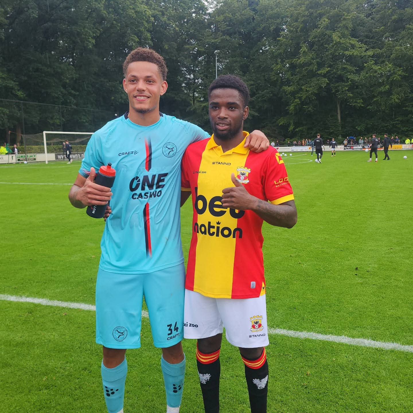 ISD player with Go Ahead Eagles player